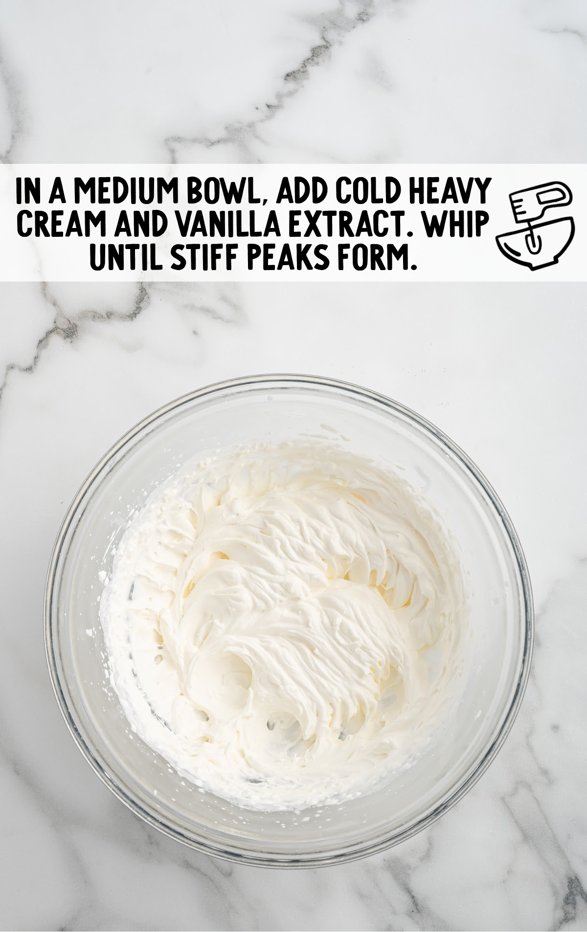 heavy cream and vanilla extract combined in a bowl