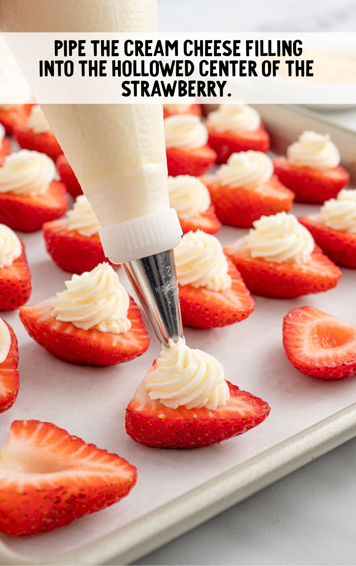 cream cheese filling piped onto the strawberries