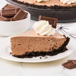 A slice of Hershey Pie on a white dessert plate.