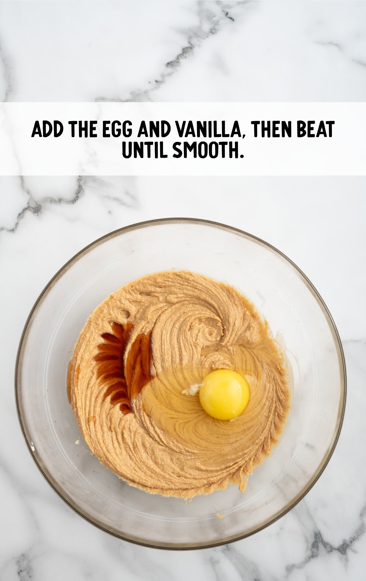 The egg and vanilla are added to the batter and mixed together.