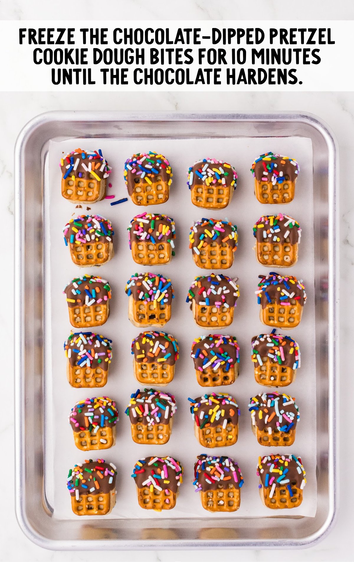 pretzels dipped in chocolate and sprinkled with sprinkles