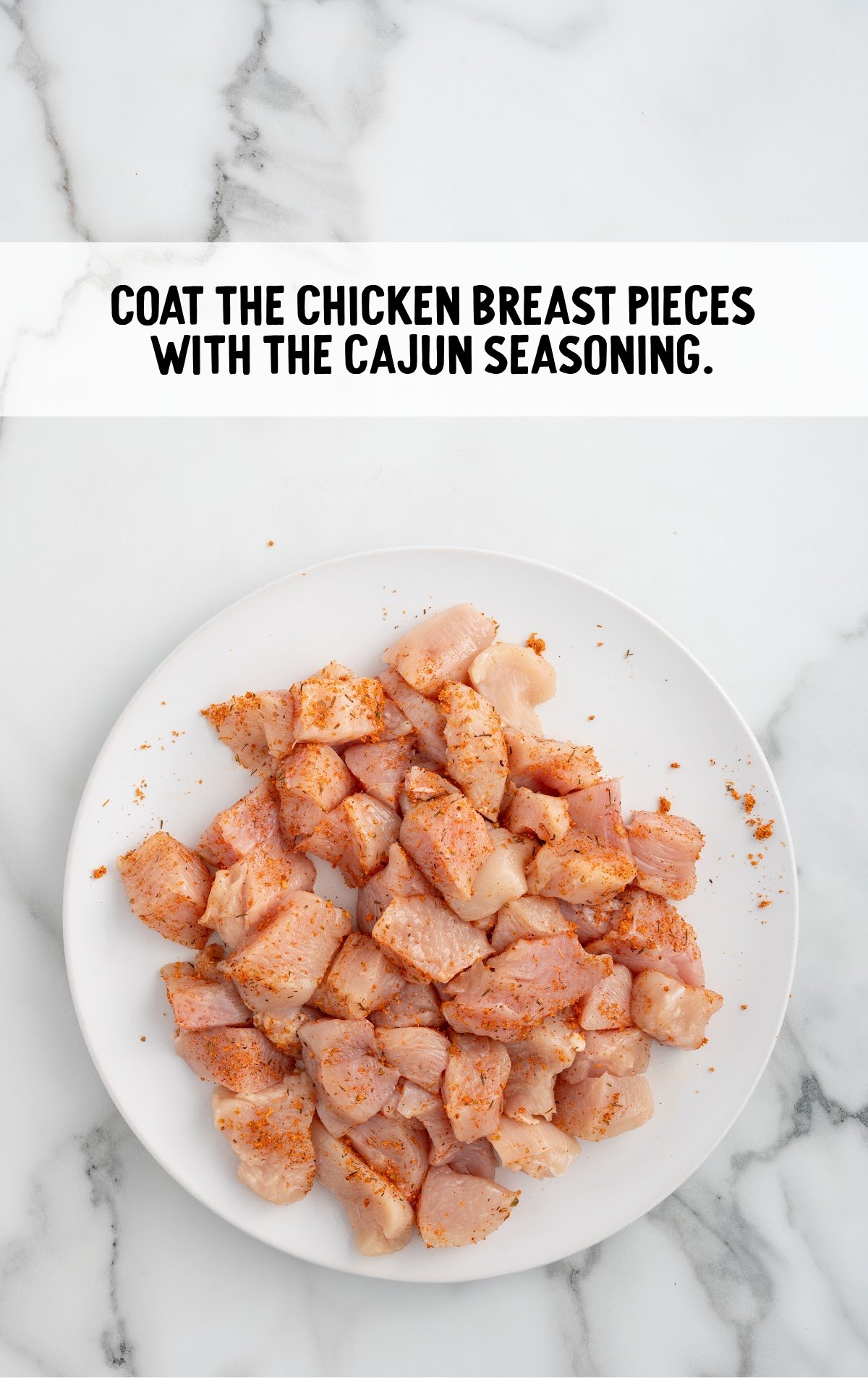 pieces of chicken breast coated with cajan seasoning on a plate