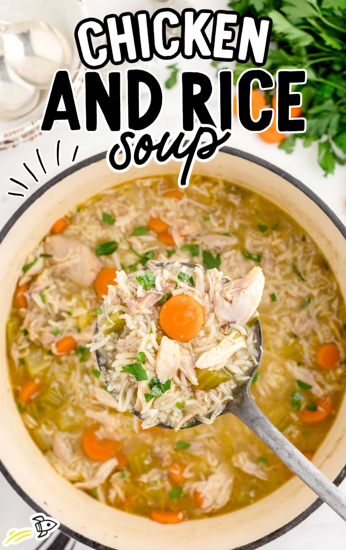Overhead view of chicken and rice soup in a Dutch oven garnished with fresh parsley