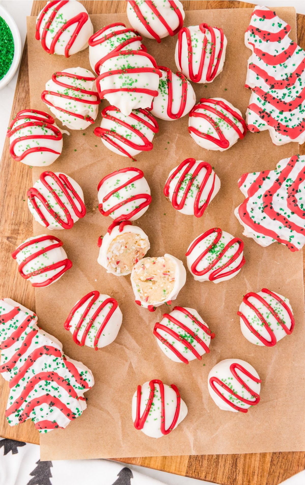 a bunch of Little Debbie Christmas Tree Cake Balls on parchment paper