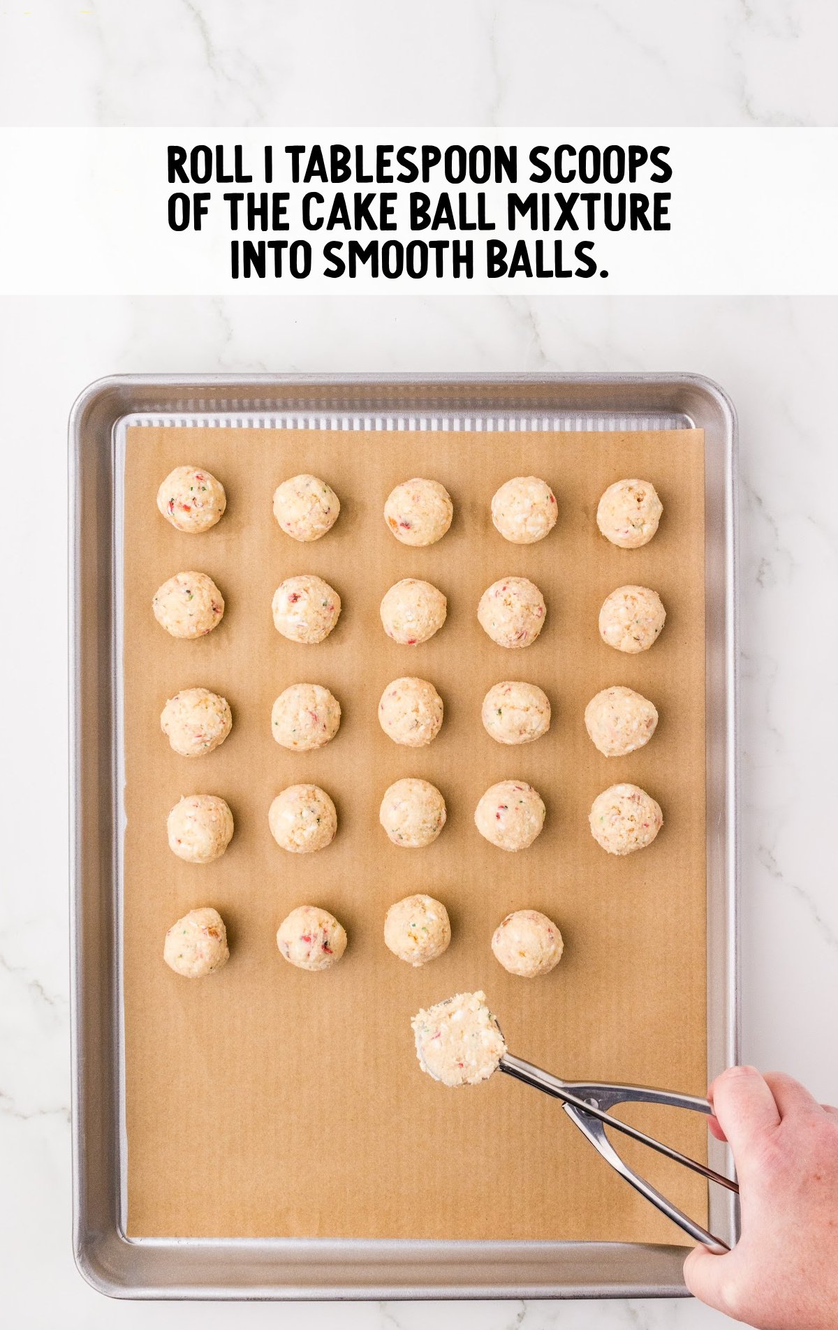 scoops of cake balls placed on a parchment paper