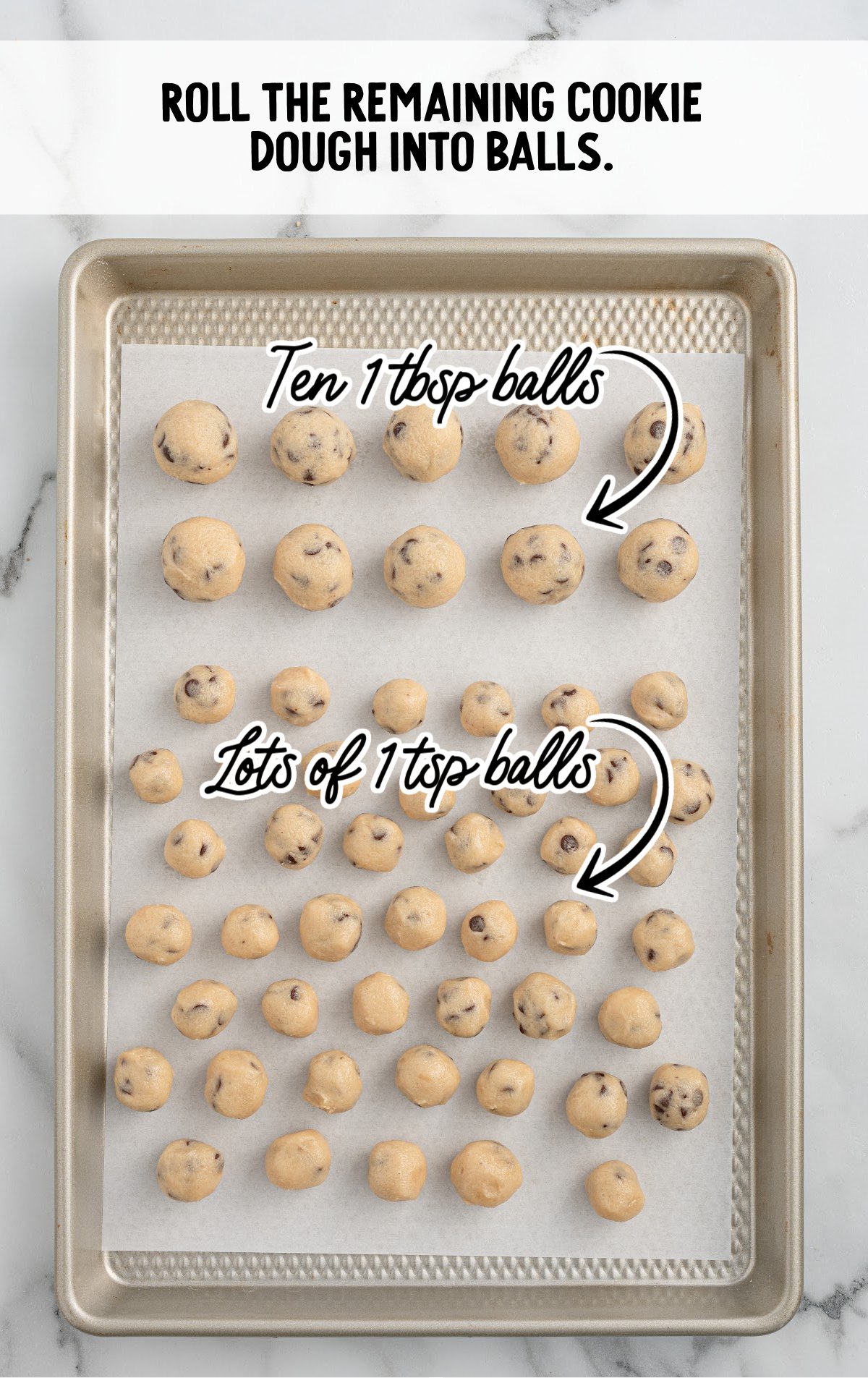 cookie dough rolled into balls on a parchment lined baking sheet