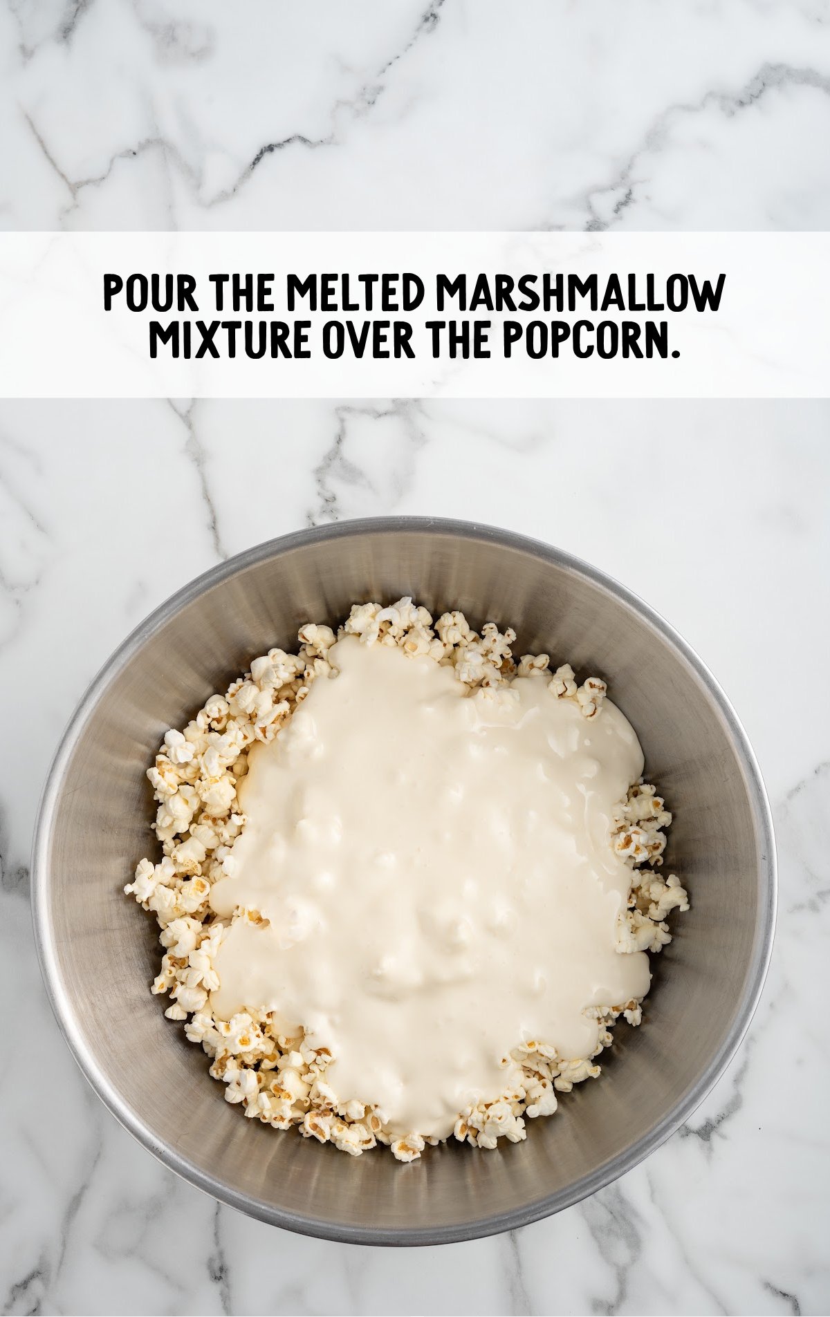 melted marshmallow mixture poured over the popcorn