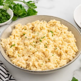 a pot of souper rice garnished with parsley