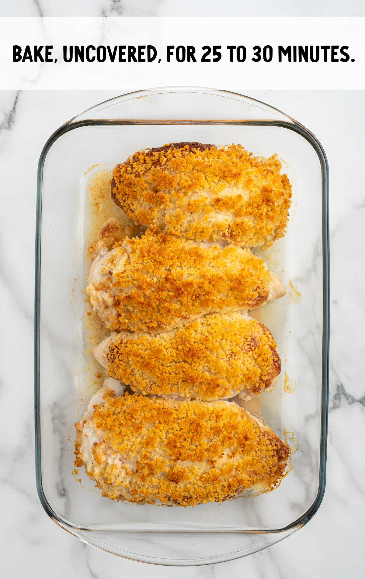 chicken with mayo and parmesan baked in a baking dish