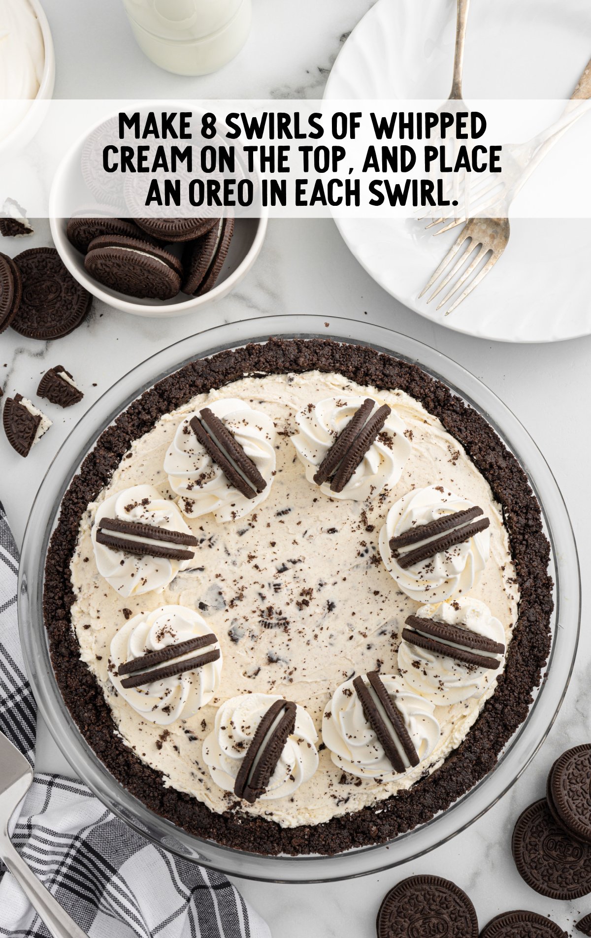 pie topped with whipped cream and oreos