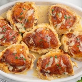 a plate of Amish Chicken garnished with parsley