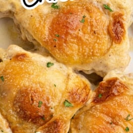 Juicy baked Amish chicken thighs topped with parsley, with overlay text "Ultra-Moist Amish Chicken – Baked in Cream & Seasonings!"