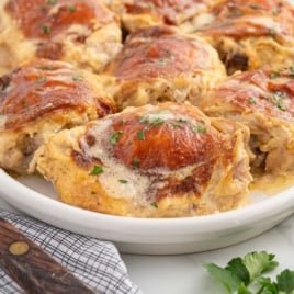 a plate of Amish Chicken garnished with parsley