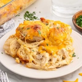 a plate of chicken bubble biscuit bake garnished with parsley