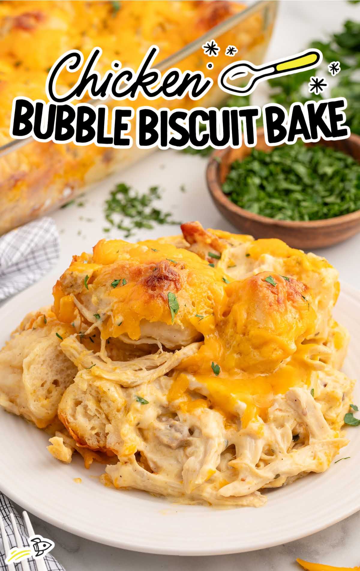 a plate of chicken bubble biscuit bake garnished with parsley