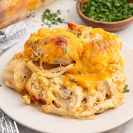 a plate of chicken bubble biscuit bake garnished with parsley