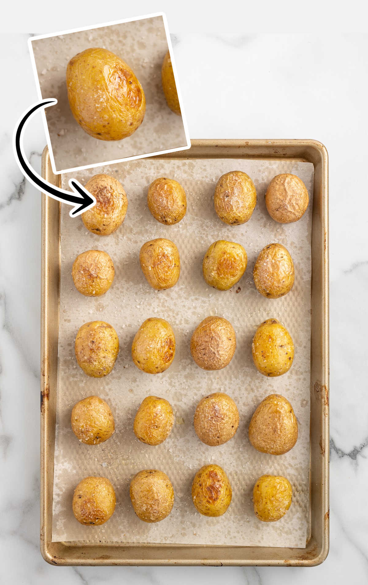 mini baked potatoes on a baking sheet