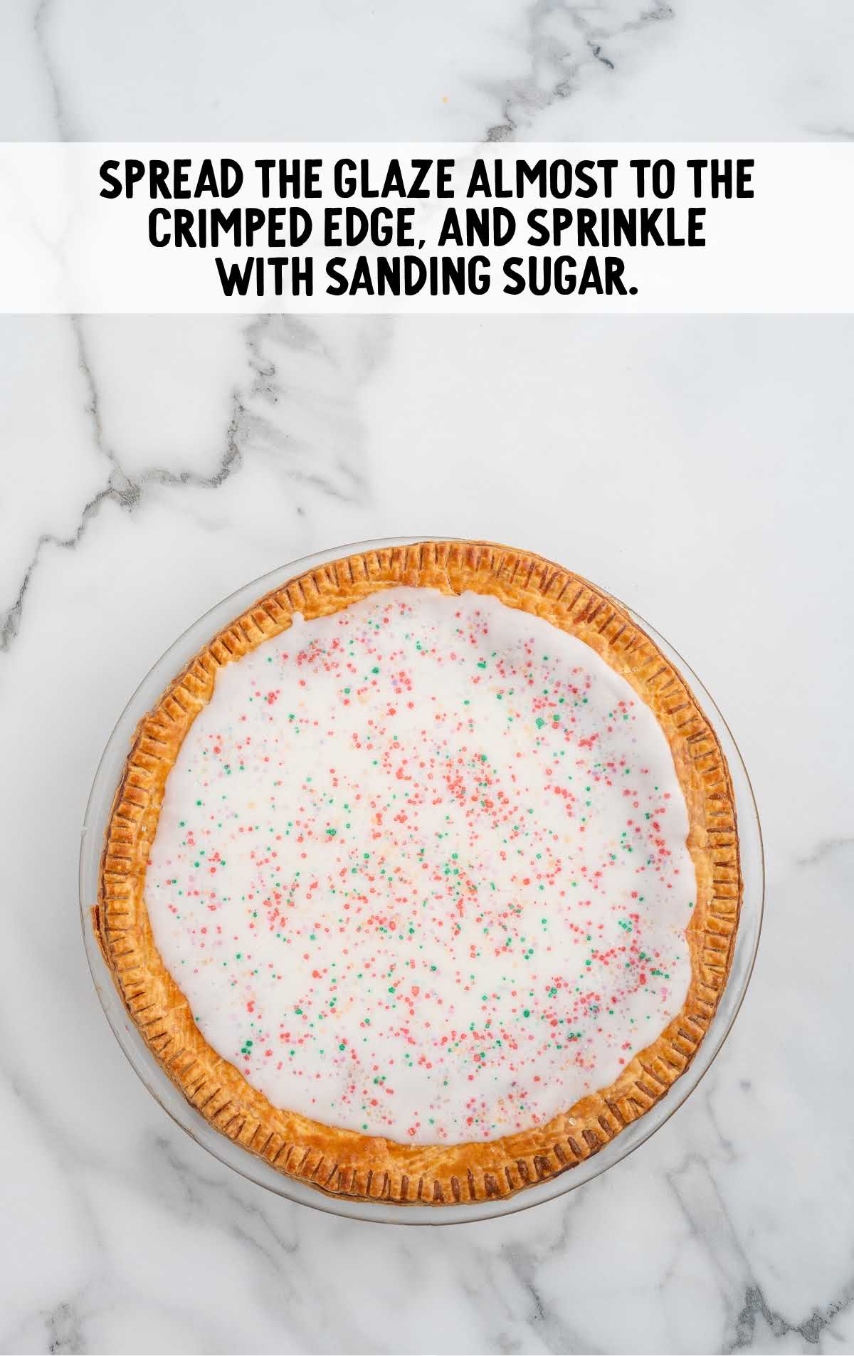 pie topped with glaze and sprinkled with sanding sugar