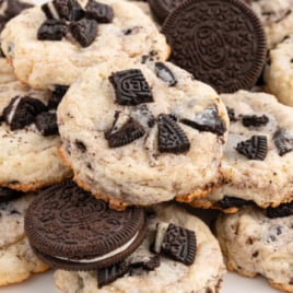 A white serving plate covered in Oreo Cheesecake Cookies.