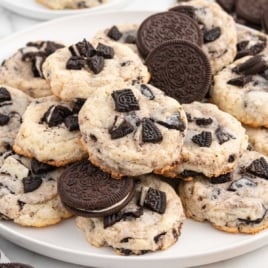 a bunch of oreo cheesecake cookies with oreos on a plate