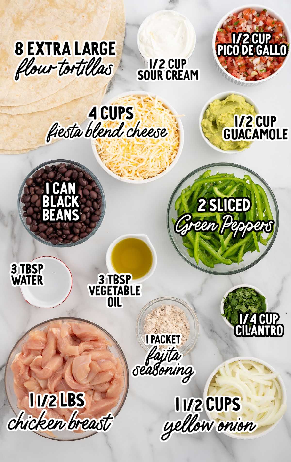 Ingredients for chicken sheet pan quesadillas arranged on a marble surface, including flour tortillas, cheese, black beans, sliced green peppers, chicken breast, and various toppings labeled with text.