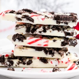 A white plate covered in Peppermint Oreo Bark.