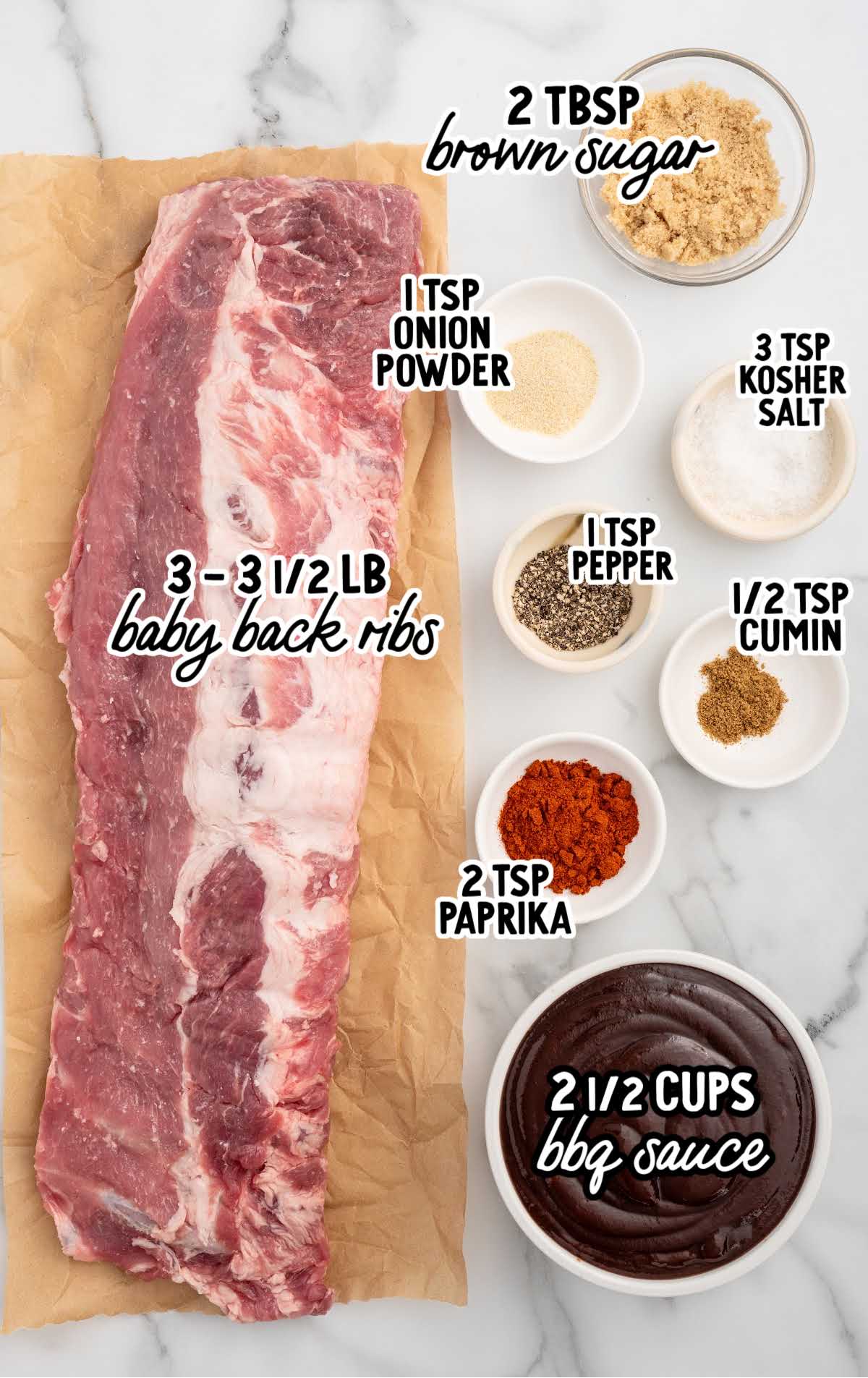 Ingredients for slow cooker BBQ baby back ribs including ribs barbecue sauce brown sugar paprika and spices