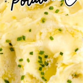 a bowl of Creamy Mashed Potatoes garnished with chives