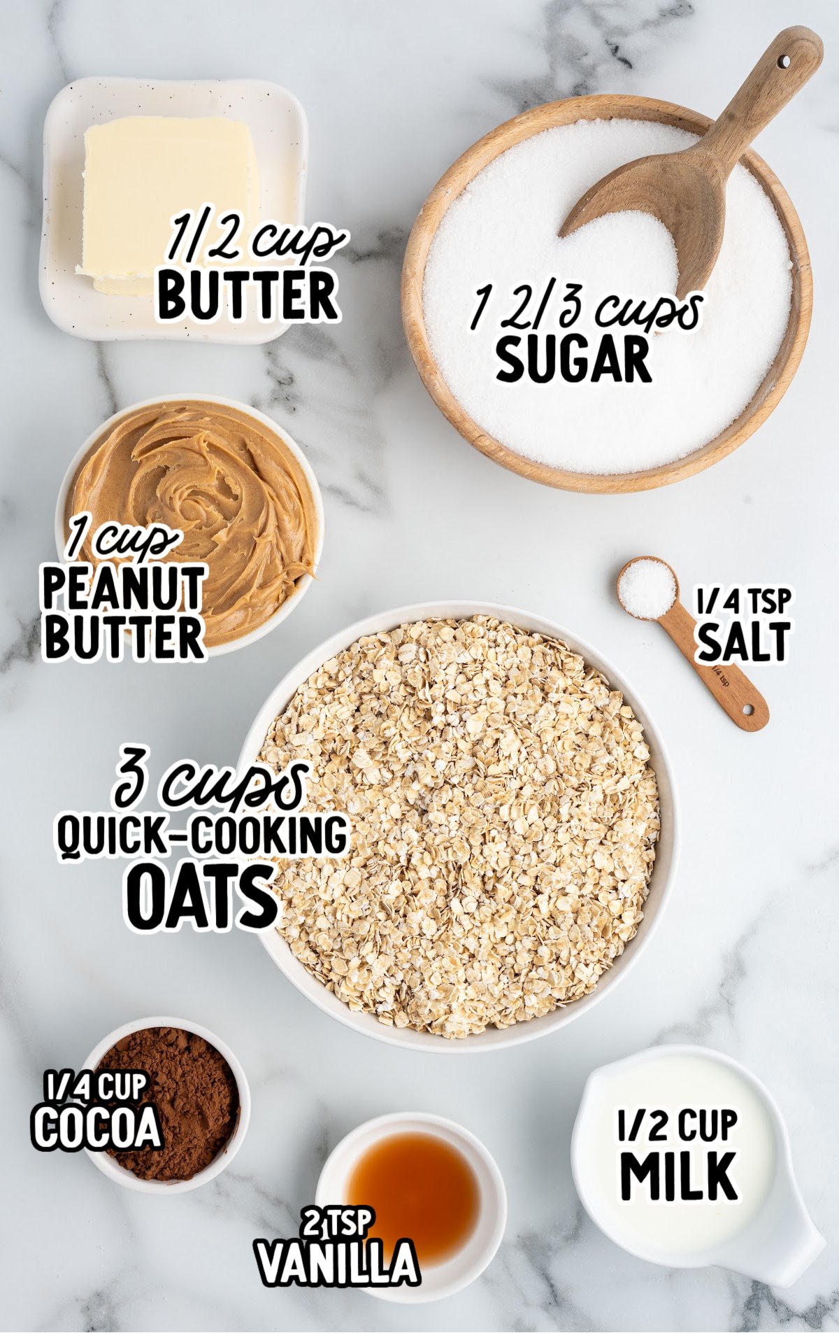 Overhead view of ingredients for chocolate peanut butter no-bake cookies, labeled with measurements. Includes: ½ cup butter, 1 2/3 cups sugar, 1 cup peanut butter, 3 cups quick-cooking oats, ¼ teaspoon salt, ¼ cup cocoa powder, 2 teaspoons vanilla extract, and ½ cup milk, all arranged on a white marble surface.