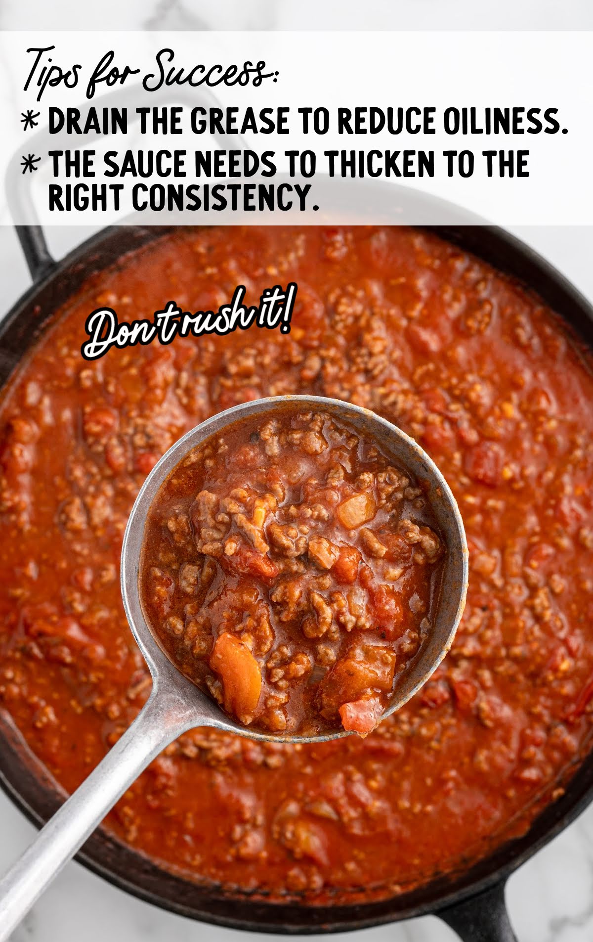 spaghetti sauce being cooked in a skillet