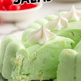 Vintage recipe graphic for seafoam salad with whipped topping and lime fluff texture shown in a mold, surrounded by cherries and dessert tools.