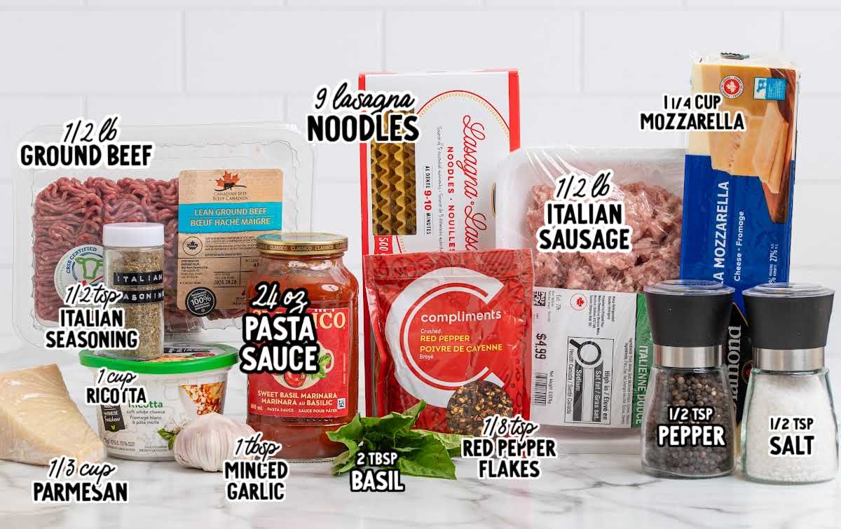 Ingredients for skillet lasagna including ground beef, sausage, noodles, ricotta, mozzarella, and pasta sauce