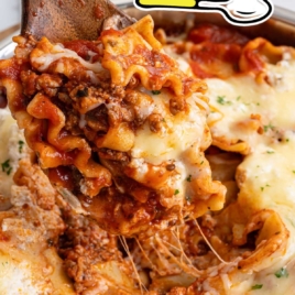 Cheesy skillet lasagna lifted from pan with long melted cheese strands