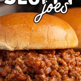 A close-up of a delicious Sloppy Joes sandwich with seasoned ground beef piled high in a soft bun. Text reads: Lunch Lady Sloppy Joes and Vintage recipe! with an arrow pointing to the sandwich.