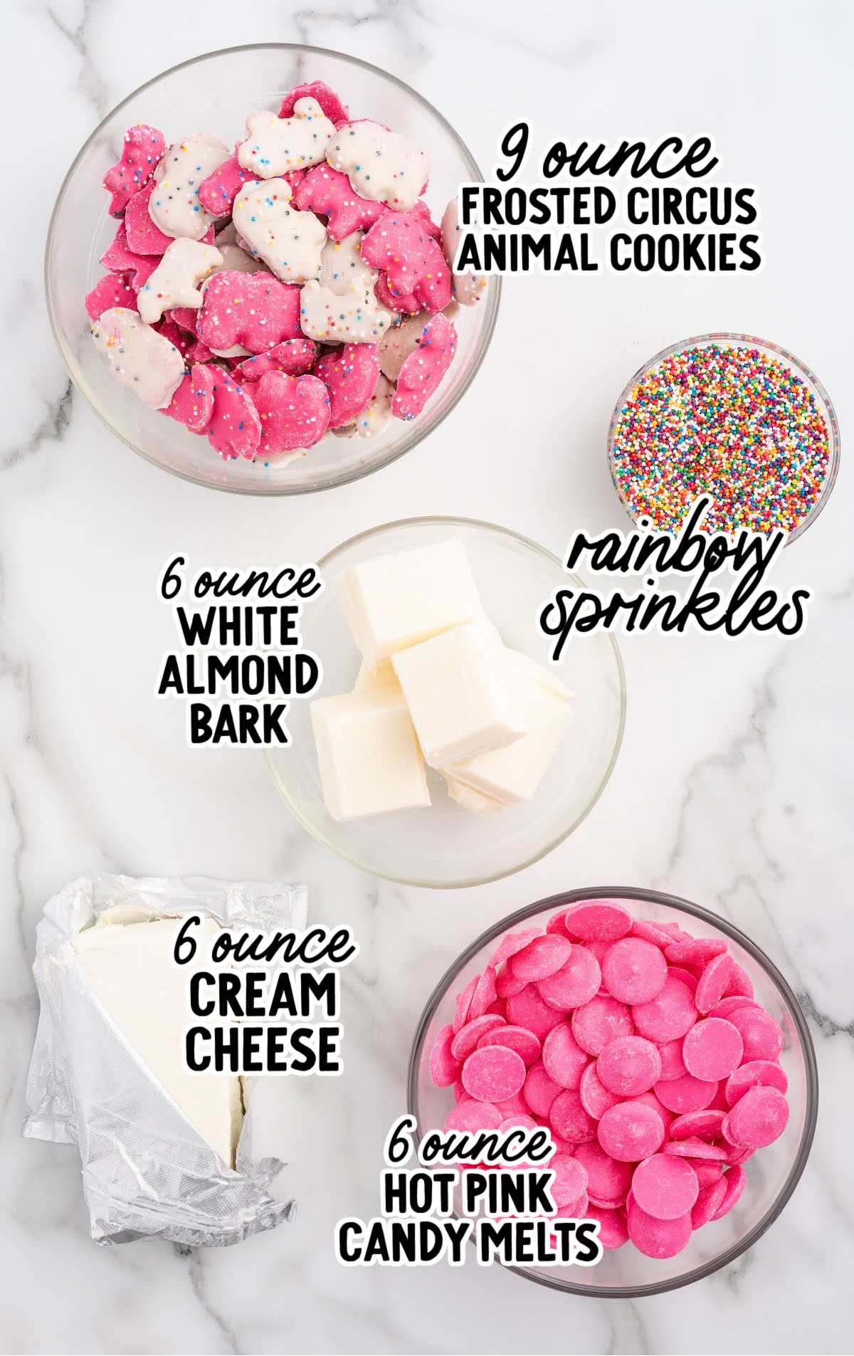Ingredients for circus animal cookie balls including frosted circus animal cookies, cream cheese, candy melts, almond bark, and rainbow sprinkles.