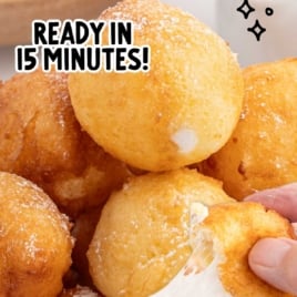 Stack of deep-fried marshmallows with a split open one showing melted interior, labeled “Deep Fried Marshmallows – State-Fair Style – Ready in 15 Minutes!”