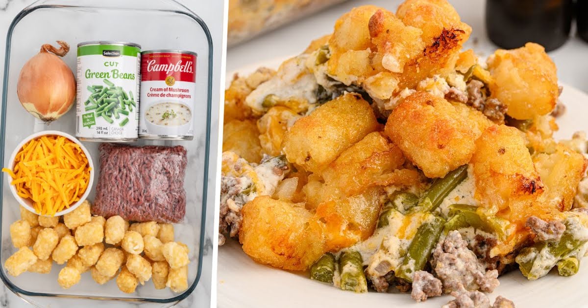 Close-up of a serving of hamburger tater tot casserole on a white plate with green beans and melted cheese.