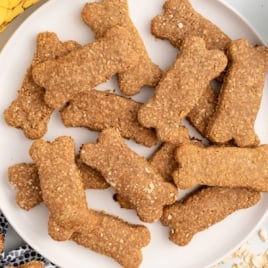 Recipe card showing step-by-step process of making banana dog treats with oats, peanut butter, and bananas.