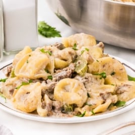 Cheesy steak tortellini with bell peppers and creamy sauce cooked together in one pan