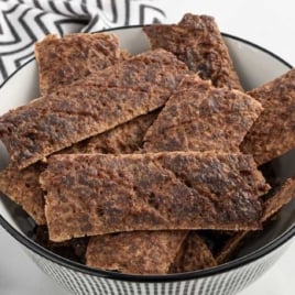 Bowl filled with strips of homemade beef jerky for dogs.
