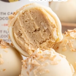 Pina colada cheesecake truffles made with Malibu rum, coated in white chocolate, and topped with toasted coconut.