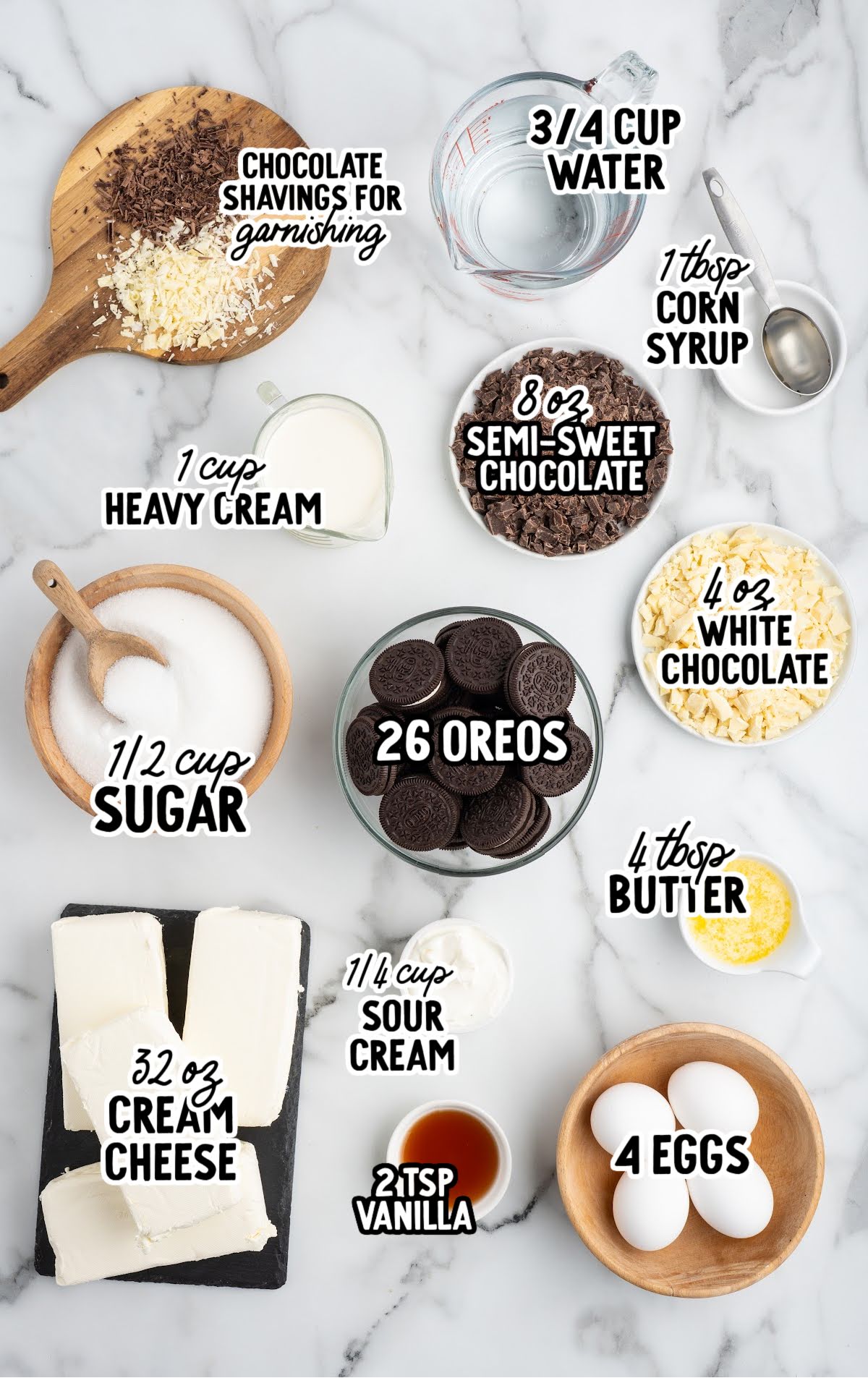 Flat lay of triple chocolate cheesecake ingredients including Oreos, cream cheese, chocolate, and eggs.