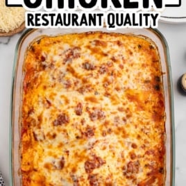 Full pan of baked ricotta chicken with golden melted cheese