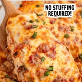 Ricotta chicken bake in a casserole dish with browned cheese and basil