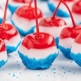 4th of July cherry bombs made with vodka soaked cherries and white chocolate