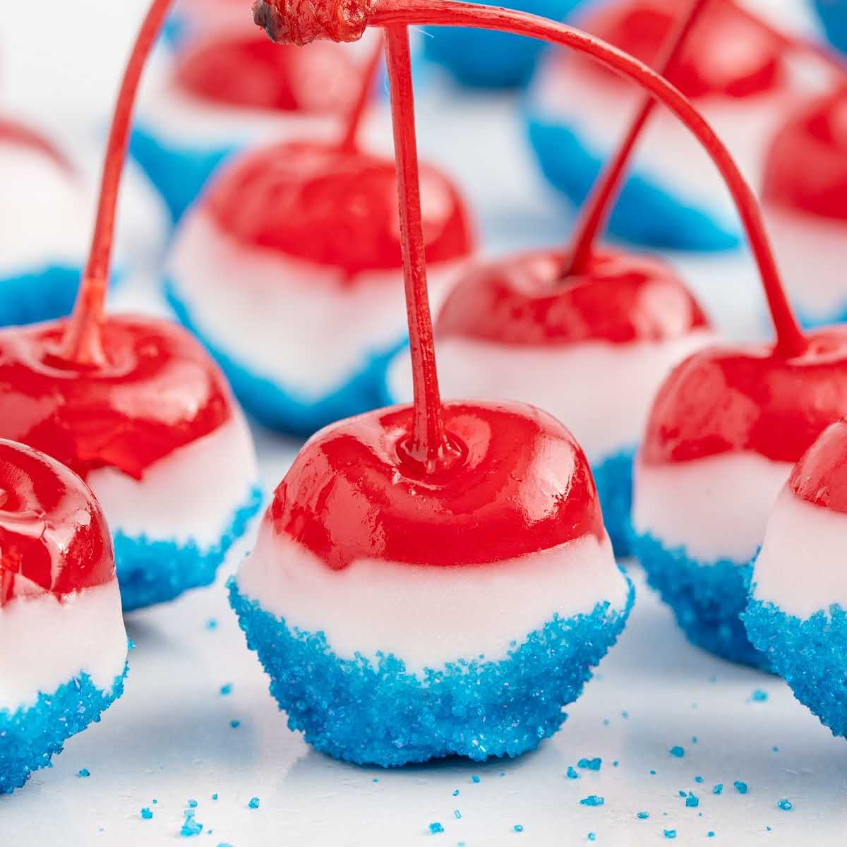 Perfectly dipped cherry bomb showing white chocolate coating and blue sanding sugar layer