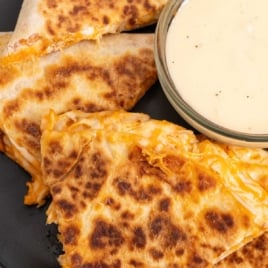 Rotisserie buffalo chicken quesadillas served with ranch dipping sauce