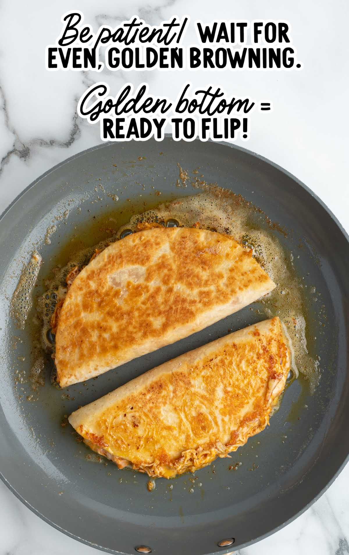 Buffalo chicken and cheese layered on flour tortillas before folding