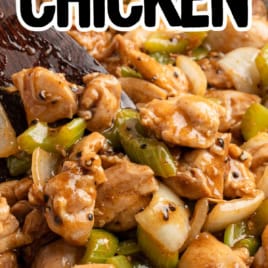 A close-up of Panda Express Pepper Chicken with green bell peppers and onions in a pan. Text on the image reads: Panda Express copycat Black Pepper Chicken Original Recipe!.